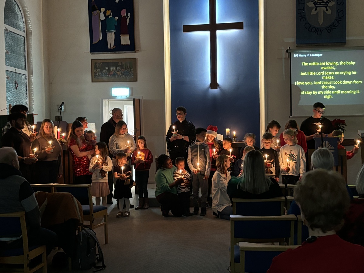 Holding our lighted Christingles